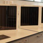 Covestro — Solar coating solutions help to harvest more energy from the sun Some demo solar panels, each partially coated with anti-reflective and/or anti-soiling coatings. Photo - Covestro