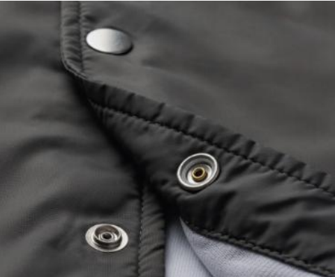 YKK sets a new standard for snap buttons 1 Low-profiled Lightweight Snap attached to a garment